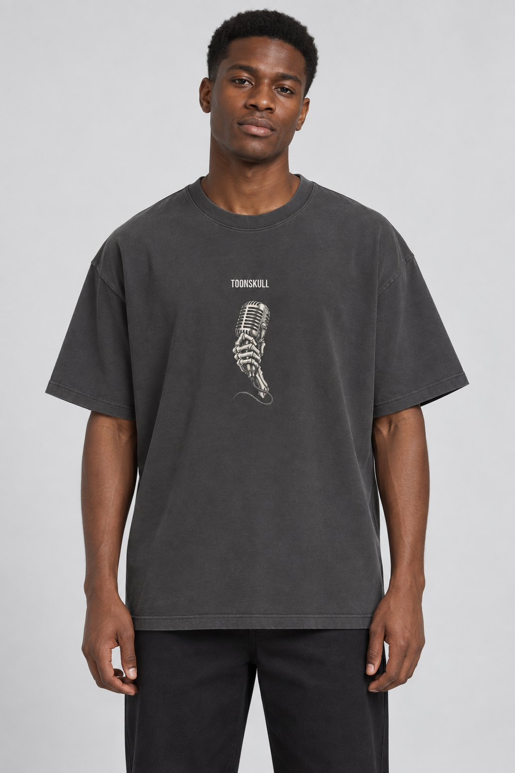 Blackout Oversized Tee shown on a man with dark skin and black hair